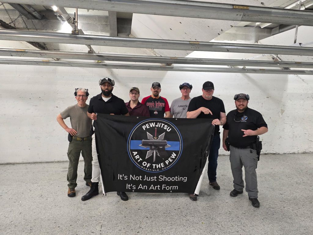 students from firearms training class with instructor